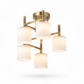 Five-light modern ceiling fixture in brushed gold with frosted glass shades